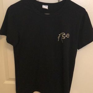 Black T-shirt with dinosaur design